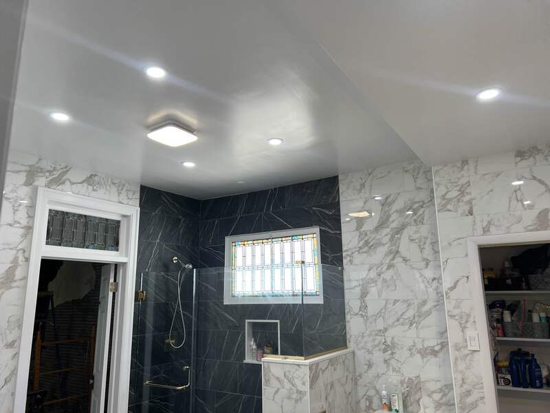 Bathroom exhaust fan and recessed lighting installation.